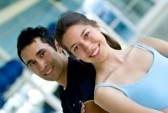 5940673-portrait-of-a-young-couple-at-the-gym-smiling